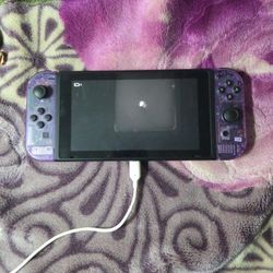 Nintendo Switch With Atomic Purple Joycons