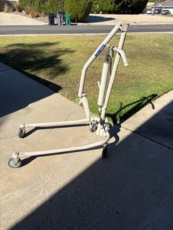 Hoyer lift with slings/harnesses.