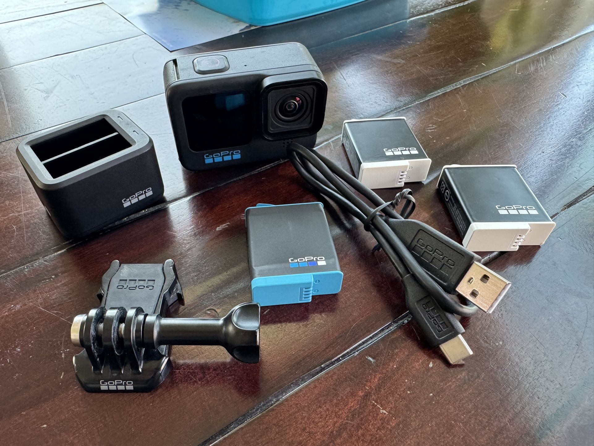 GoPro Hero 10 with 3 batteries, charger, mount and cable