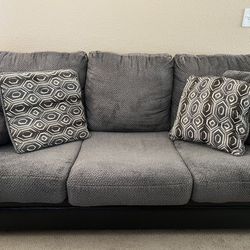 Gray and black leather couch