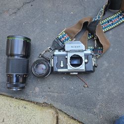 Vintage Nikon F Camera With A 50mm And A 300mm Lense