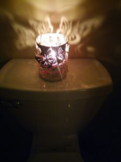 Metal stainless steel butterfly candleholder and a stainless butterfly nightlightthat is also a candle warmer