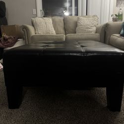 Black leather ottoman