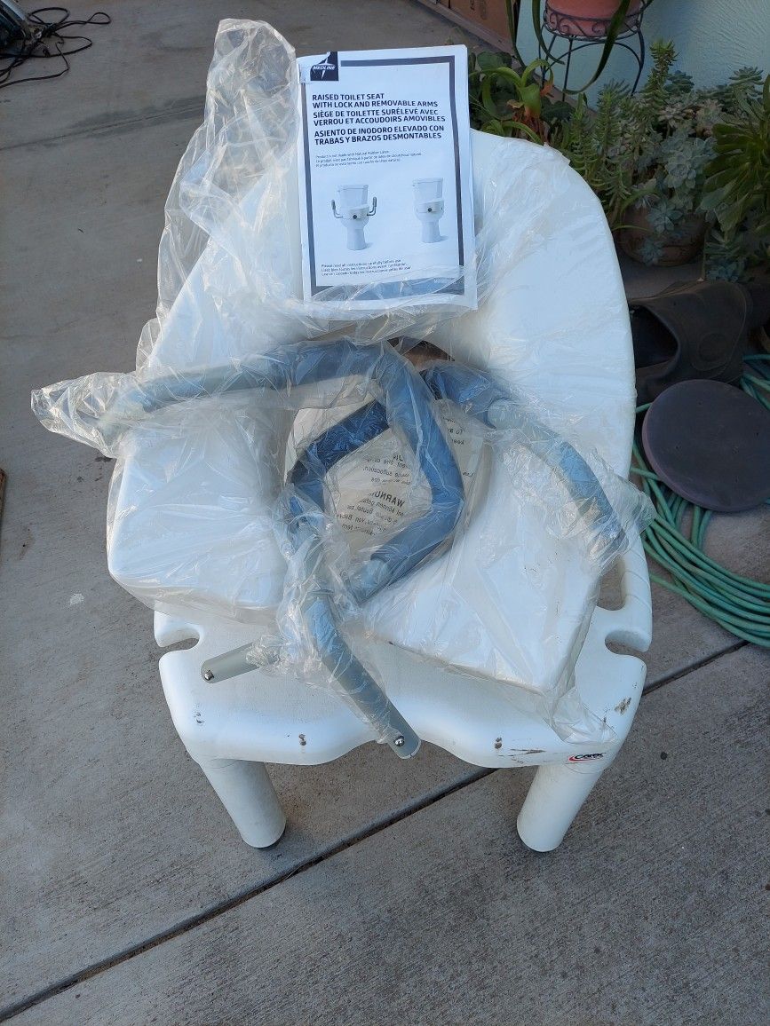 Raised toilet seat (Midline).  New