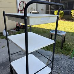 IKEA cart metal with plastic shelves, top tray,  wheels on one side