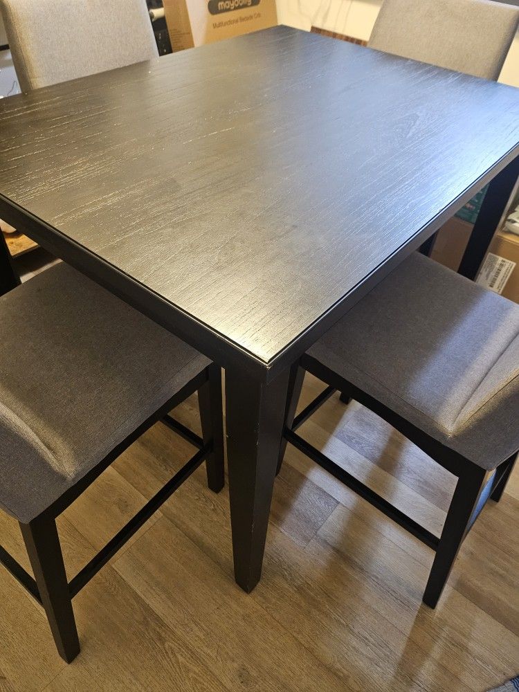 Tall kitchen table with four chairs