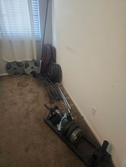 Squat rack with weights and bench