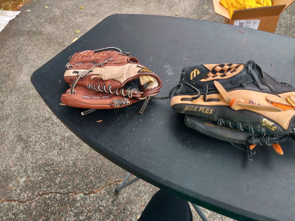 Two boys baseball gloves