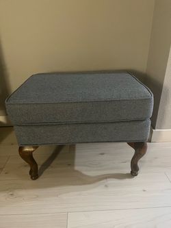 Gray Upholstered Ottoman with Wood Legs