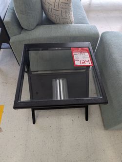 The Canberra Collection's architectural design and sleek contemporary aesthetic pairs form with function. Crafted from bold, black sandblasted mango, 