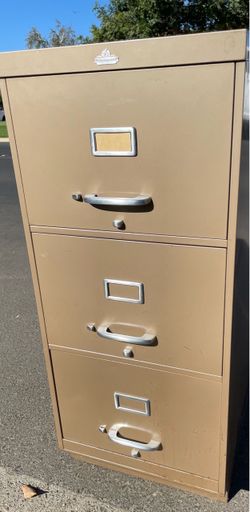 Three drawer metal file cabinet