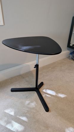 Adjustable triangular table