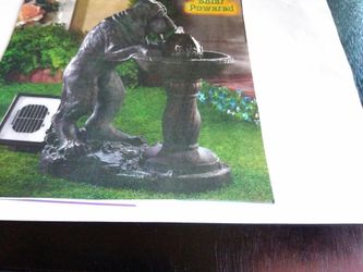 Solar dog garden fountain