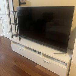 70 inch Sharp 4K smart TV with standing desk