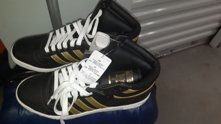 adidas Top Ten Hi sneakers in a black and gold