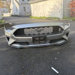 I'm selling the front bumper of a Ford Mustang with its original tracks and the bumper is original in perfect negotiable condition for a 2019 Ford Mus