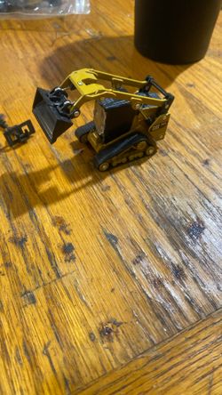 Die cast Masters Skid Steer With Attachments