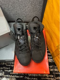 Nike Air Jordan 6 Retro "Chrome" sneakers, featuring a black nubuck upper and metallic silver accents on the midsole