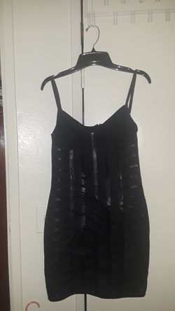 Black dress size Small but can fit Medium, Large very stretchy.
