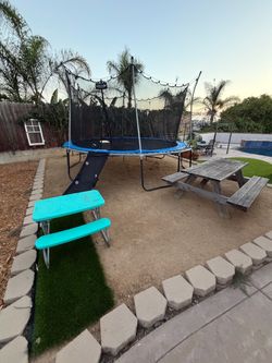 Round Trampoline with Safety Net and rock climbing Slide, 7ft wood picnic table, and kids fold out Picnic table