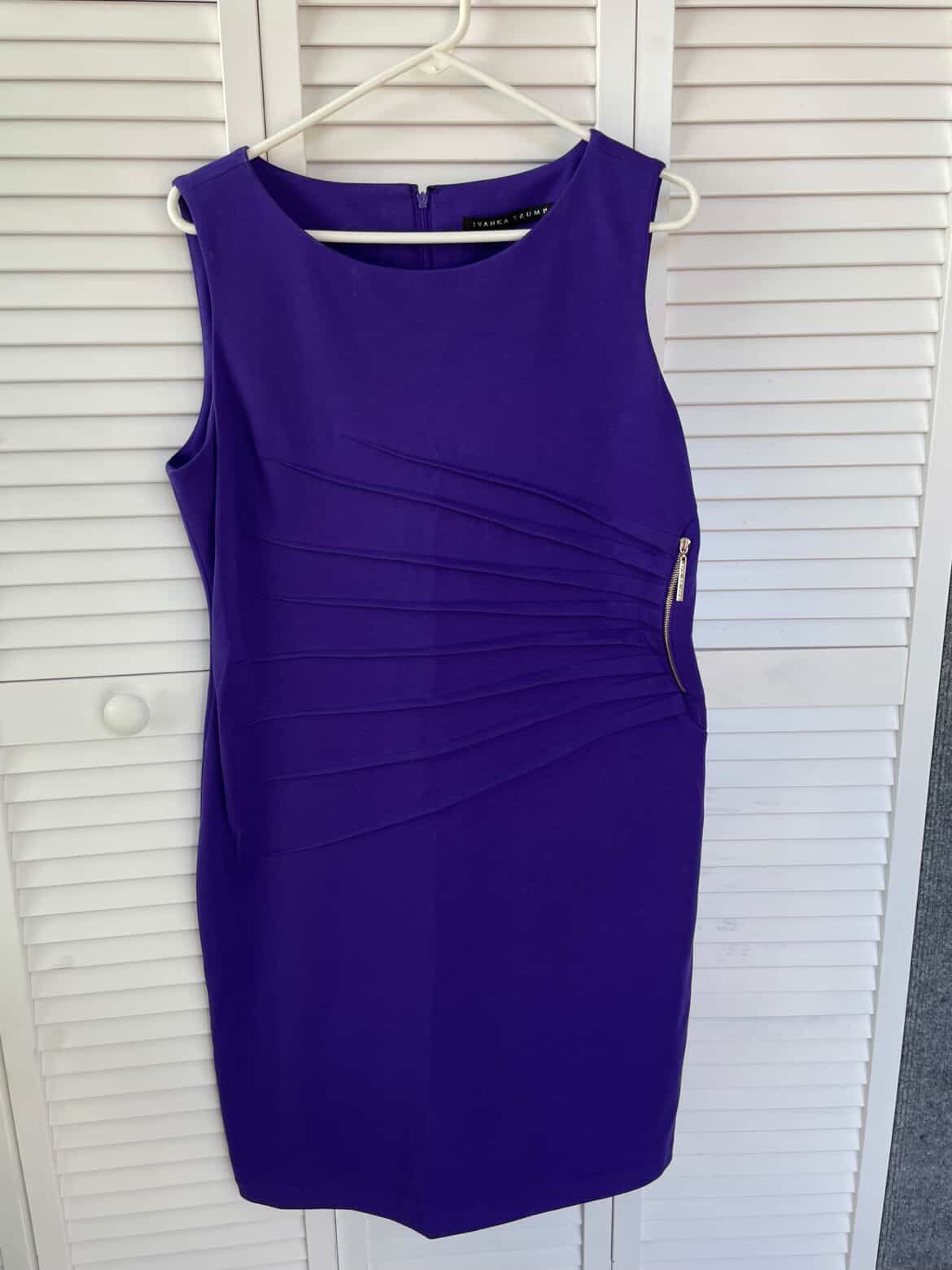New This is a purple Ivanka Trump sheath dress with a golden zipper on the side and pleats (drapery). The dress is made of knitted fabric, has a round