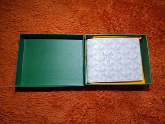 Brand new, never used. Classic white Goyardine bifold with full packaging (box, cloth, tags & papers). Made in France.