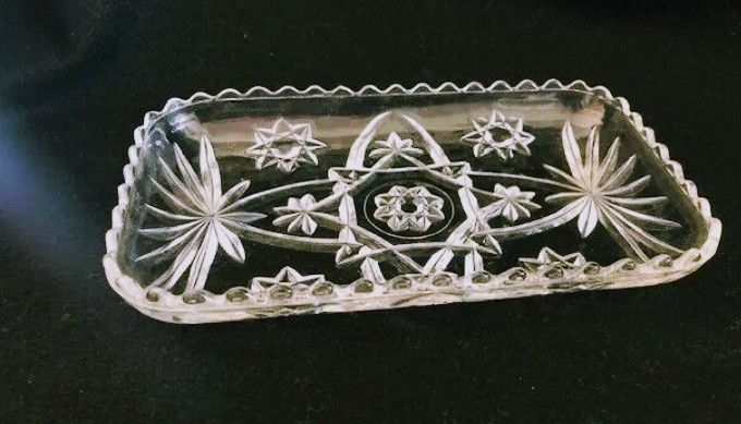 Anchor Hocking EAPC 12" Oval Relish And Vintage Anchor Hocking Gondola Dish: Clear Glass, Flower Star Pattern, Scalloped Edges.

Measures 9 1/4" long
