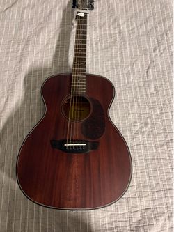 Orange wood acoustic guitar