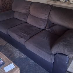 Brown couch and loveseat