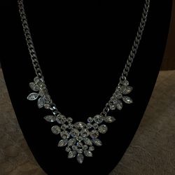 Givenchy silver-tone necklace featuring marquise-cut crystal embellishments and a V-shaped bib design.