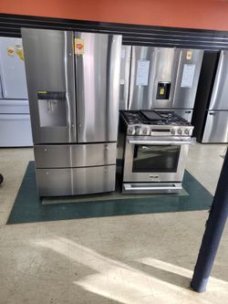 Lg Refrigerator And Slide In Gas Stove