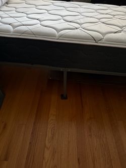 Twin mattress with frame.