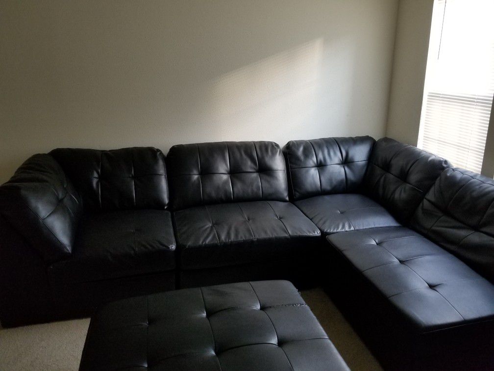 Leather sectional sofa + ottoman