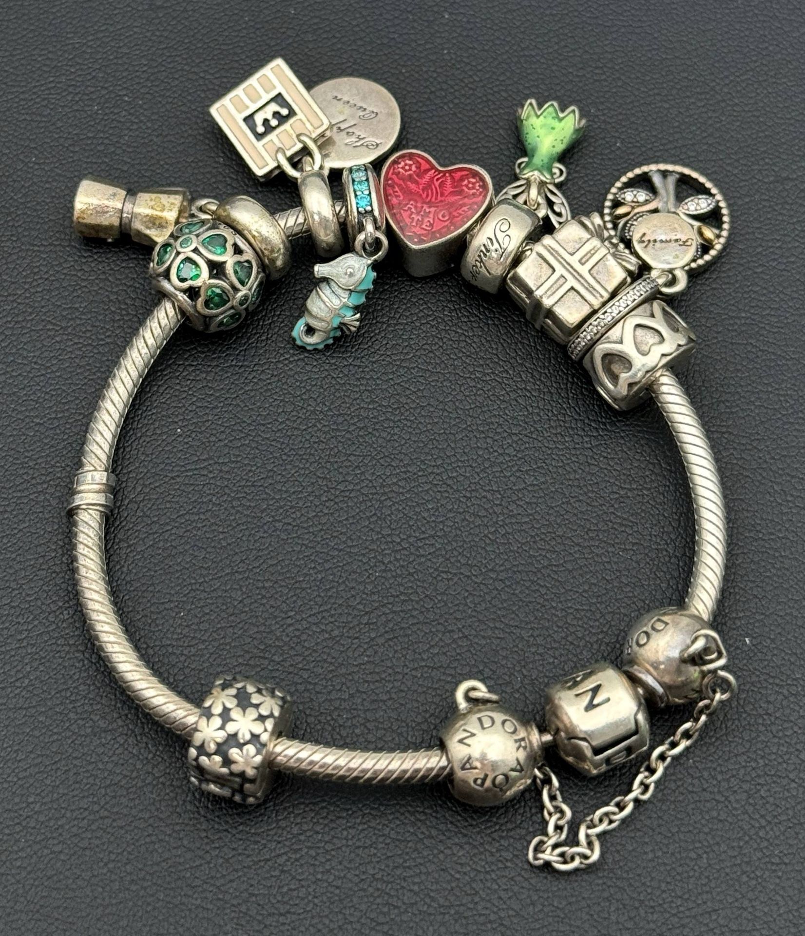 Jewelry Pandora 925 sterling silver gold tone 6.75” charm bracelet with 10 charms