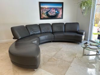Modern Dark grey leather sofa and a coffee table