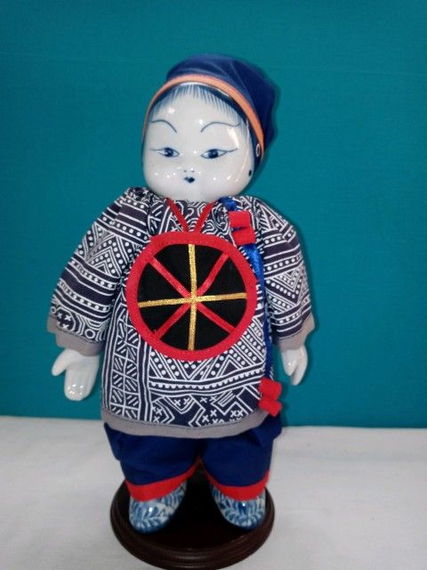 Vintage Asian doll.  Ceramic head, hands and feet. Made In Taiwan 