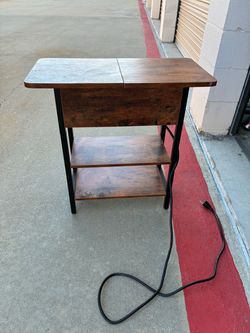 Side table with electrical outlets