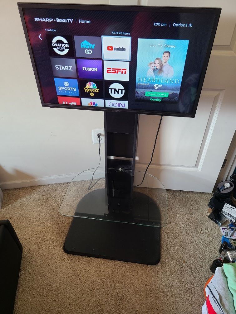 Wooden mount TV stand with Sharp Roku TV