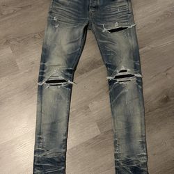 black patch amiri jeans 