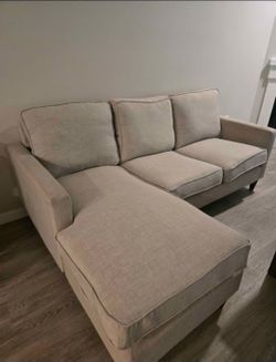 Light grey fabric L shaped sofa