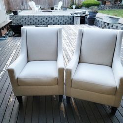 Two cream colored chairs.
