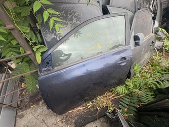 2011 Toyota Corolla left front door dark blue