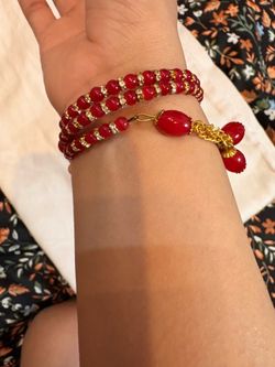 Red and Gold Beaded Bracelet with Charms