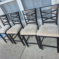 Four Wooden Matching Barstool Chairs For Sale. 