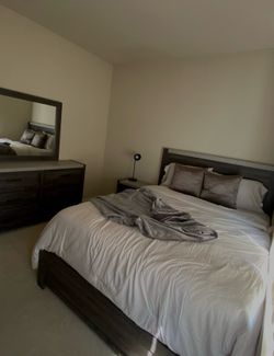 Queen bedroom set along with mattress and encased edge support.