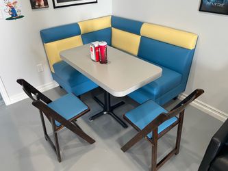 Retro diner booth with table and chairs