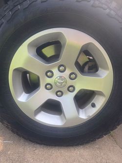 ​2019+ Dodge Ram 1500 OEM Wheels & Falken Wildpeak A/T  at3wa Tires - Set of 4
