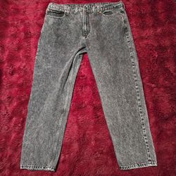 Vintage Levi's jeans featuring a black acid wash finish and a classic straight-leg fit.Size 40W Levi Strauss & Co.

Style: 501 Original Fit (implied b