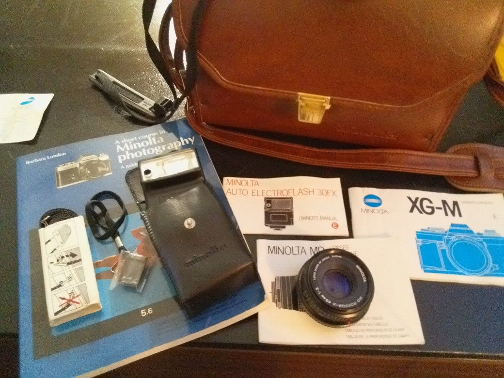 Minolta XG-M 35mm. MDROKKOR-X4mm1:2 Lens. MD Tele ROKKOR-X 135mm1:3.5 Lens. Auto Electroflash 30FX. Manuals. Minolta Photography Course Carrying Bag.