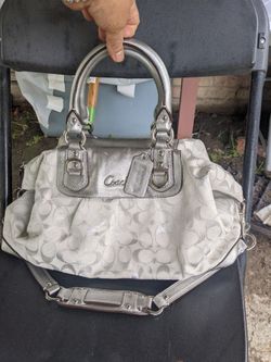 White and silver Coach purse